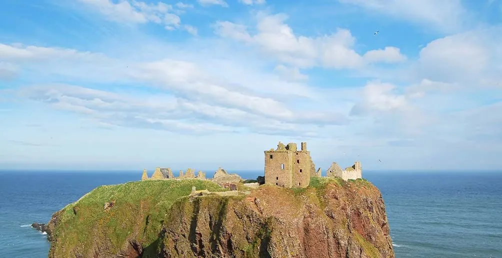 Footage of a castle on a mountain with view on the sea in Highlands, Scotland