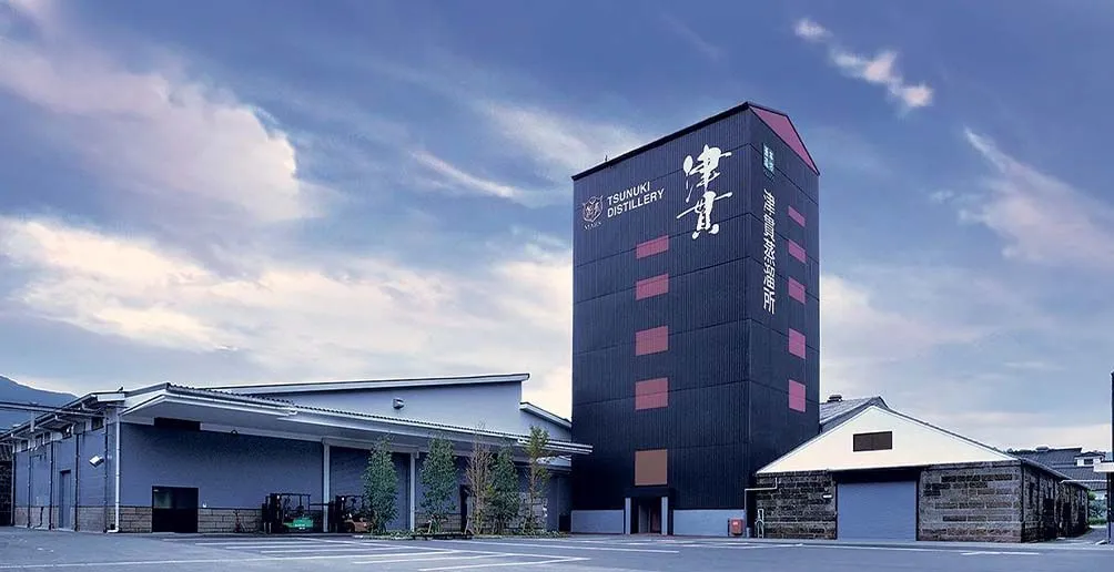 Mars Tsunuki distillery's building with the company's name and logo on the wall standing against the blue sky
