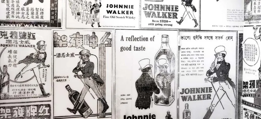 A collection of old Johnnie Walker newspaper advertisements in different languages