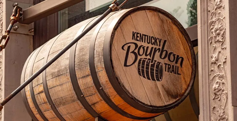 Cask advertising for the famous tour Kentucky Bourbon Trail hung in front of the entrance door to Frazier Bourbon Museum, Kentucky