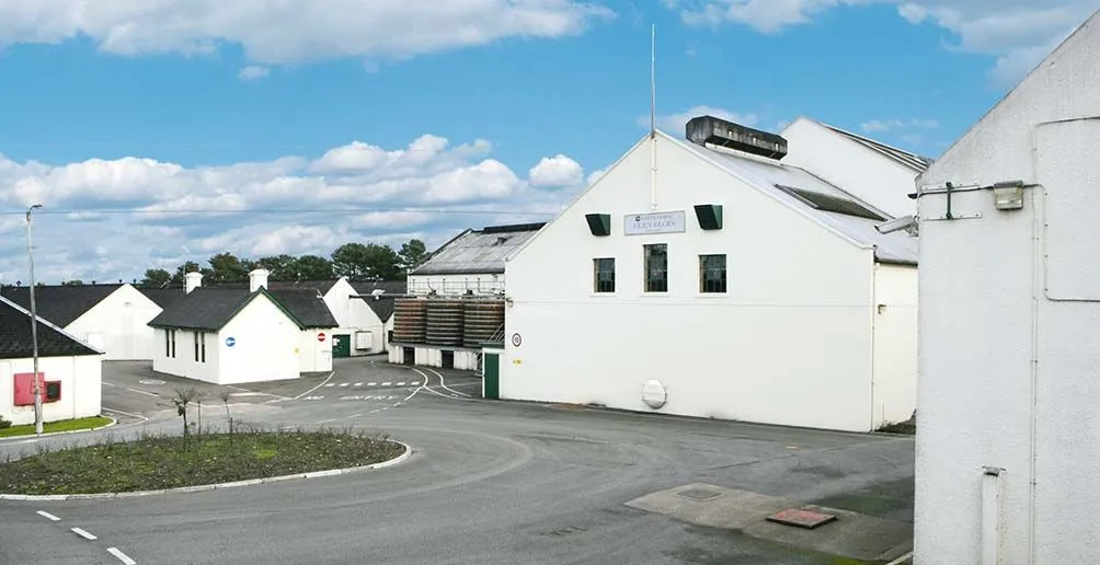 Glen Elgin's distillery buildings surrounding a roundabound on a nice day