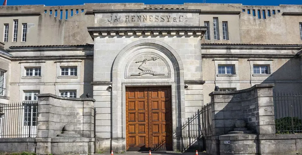 The headquarters of Maison Hennessy with company's name and logo carved on the front wall