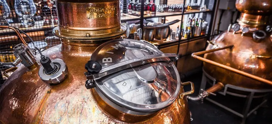 Close view of a copper pot still in Bimber distillery with silver-colored lid