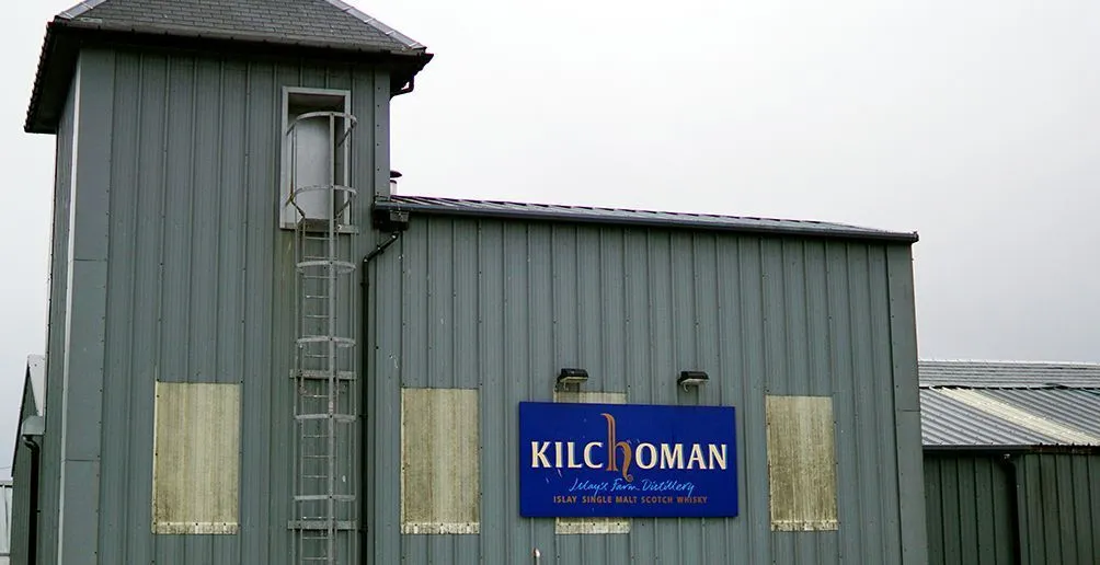 Kilchoman distillery's building made of metal sheets with its name sign attached on the front wall