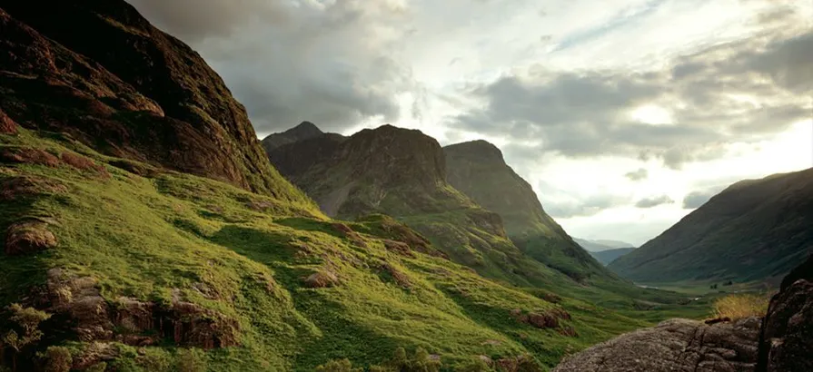 Steep slope among green hills in the scottish Speyside on a dull day