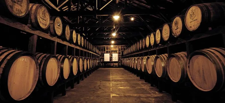 Two shelves full of casks in Tsunuki's wooden warehouse