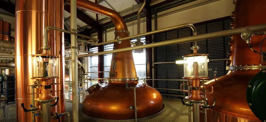 Close view on copper pot stills inside of InchDairnie's still house