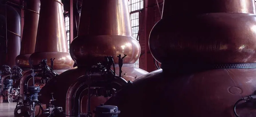 Copper pot stills standing in a row in Miyagikyo still house