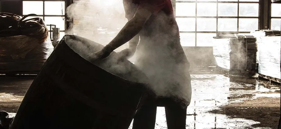 Casks getting cleaned up with warm water at Gordon and Macphail's warehouse