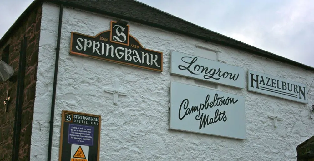 Name signs of whisky brands produced at Springbank distillery attached on the wall