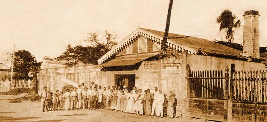 A historic picture of Bacardi's employees standing in front of the first Bacardi distillery