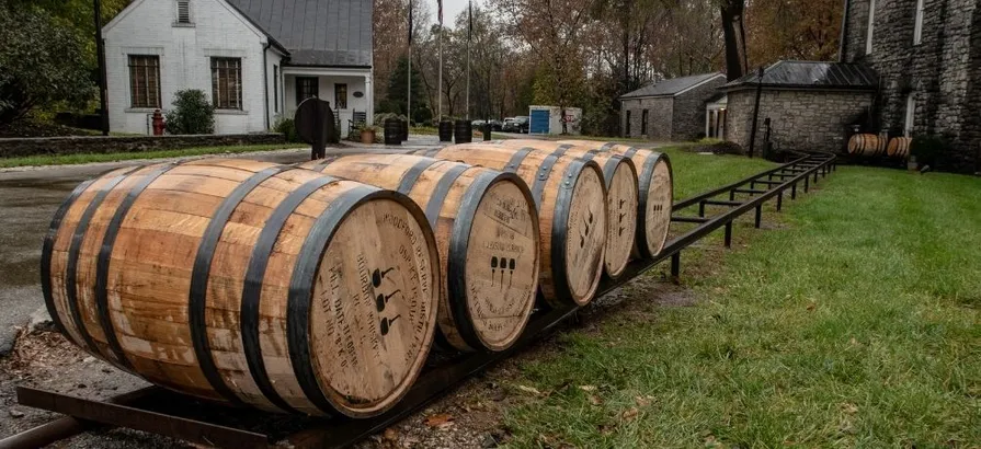 Backyard of Woodford Distillery with five casks waiting to be used