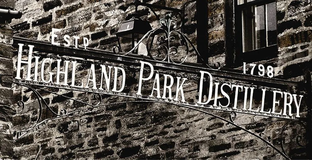 Black and white picture of Highland Park distillery name sign on the gate