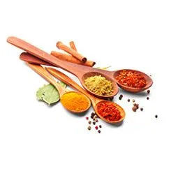 A few spoons loaded with different spices