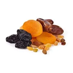 A pile of dates, raisins and dried apricots